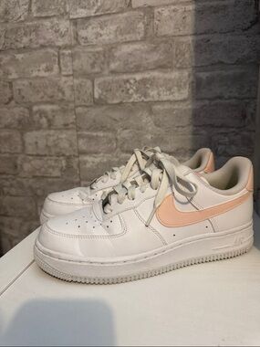 Nike White Low-Top Sneakers with Peach Swoosh